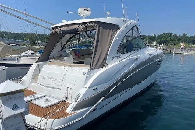 The Image of 2011 Cruisers Yachts 360 Express docked in a marina, rear view. - 0