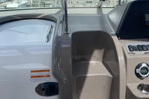 Slide: The Image of 2011 Cruisers Yachts 360 Express helm with control panel and seating area. - 11