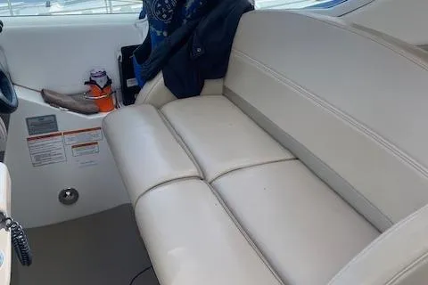 Slide: The Image of 2011 Cruisers Yachts 360 Express interior with white leather seating and control panel. - 12