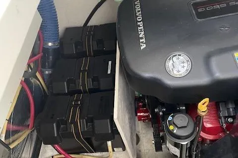 Slide: The Image of 2011 Cruisers Yachts 360 Express engine compartment with Volvo Penta engine and battery setup. - 18