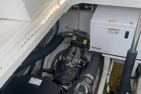Slide: The Image of Engine compartment of 2011 Cruisers Yachts 360 Express with Kohler power system. - 19