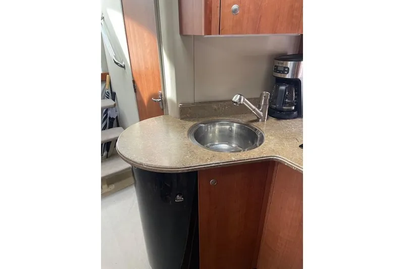 Slide: The Image of 2011 Cruisers Yachts 360 Express kitchen with sink, countertop, and coffee maker. - 32