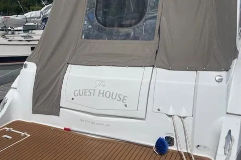 Slide: The Image of 2011 Cruisers Yachts 360 Express, "The Guest House," docked with cover, Suttons Bay, MI. - 4