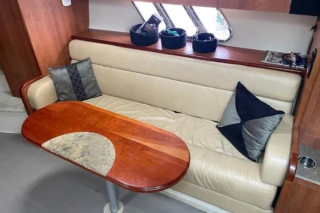 Slide: The Image of Luxurious interior of 2011 Cruisers Yachts 360 Express with leather seating and elegant wooden table. - 41