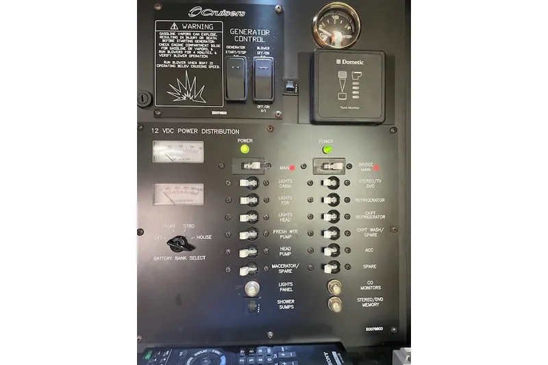 Slide: The Image of Control panel of a 2011 Cruisers Yachts 360 Express, featuring power distribution switches. - 42