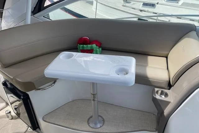 Slide: The Image of 2011 Cruisers Yachts 360 Express interior with seating and table. - 5