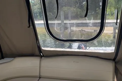 Slide: The Image of 2011 Cruisers Yachts 360 Express interior with beige seating and window view. - 7