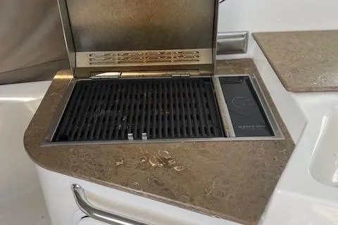 Slide: The Image of Built-in grill on 2011 Cruisers Yachts 360 Express, featuring a sleek countertop design. - 9