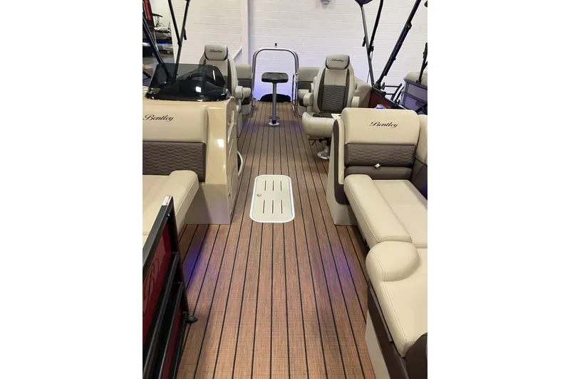 Slide: The Image of Luxurious interior of 2026 Bentley Pontoons 223 Elite Admiral with plush seating and wood flooring. - 10
