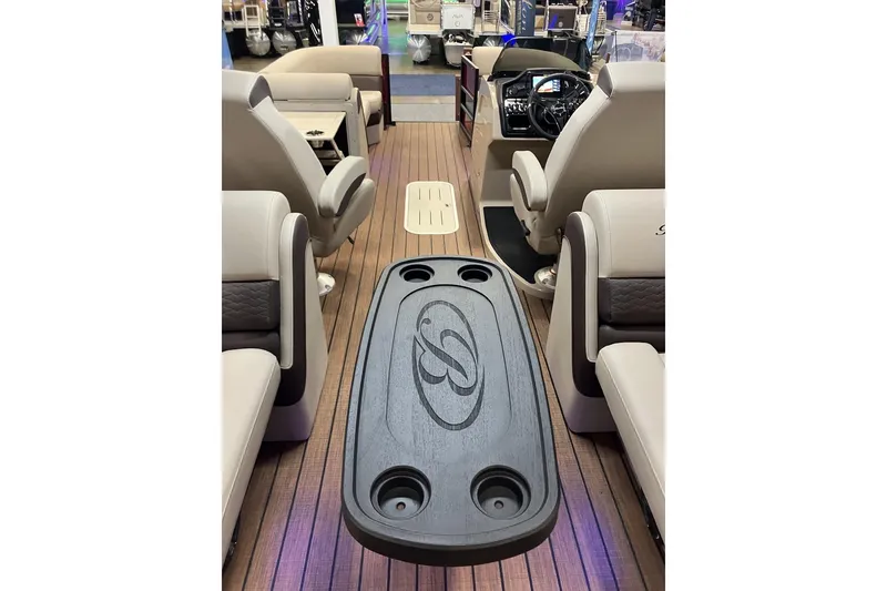 Slide: The Image of 2026 Bentley Pontoons 223 Elite Admiral interior with luxurious seating and stylish table design. - 3