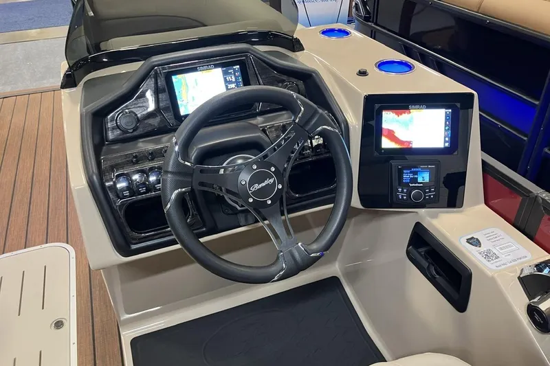 Slide: The Image of 2026 Bentley Pontoons 223 Elite Admiral dashboard with steering wheel and navigation displays. - 4