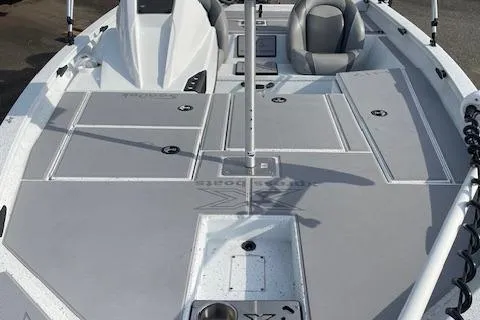 Slide: The Image of 2023 Xpress H17 boat deck with seating and storage compartments. - 5