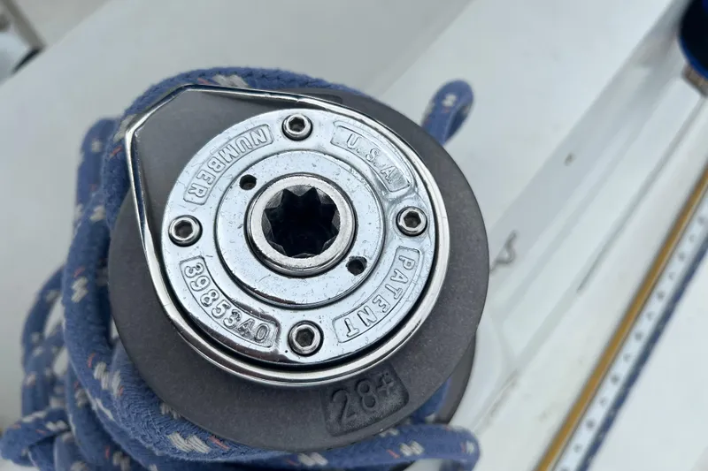 Slide: The Image of Winch mechanism on 1985 C&C Landfall 39 sailboat, featuring rope and patent details. - 15