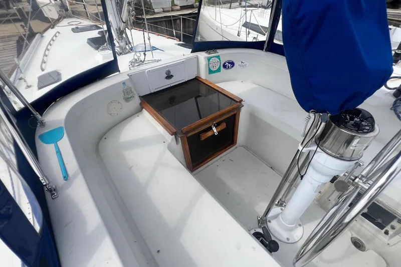 Slide: The Image of 1985 C&C Landfall 39 sailboat cockpit with steering wheel and hatch. - 22