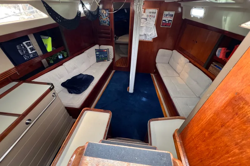 Slide: The Image of Interior of 1985 C&C Landfall 39 sailboat with cozy seating and nautical decor. - 23