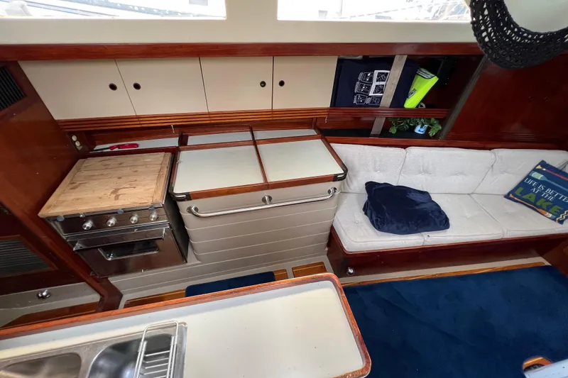 Slide: The Image of Interior of 1985 C&C Landfall 39 sailboat with kitchen and seating area. - 24