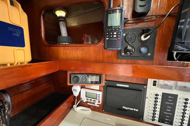 Slide: The Image of Navigation equipment inside a 1985 C&C Landfall 39 sailboat cabin. - 29