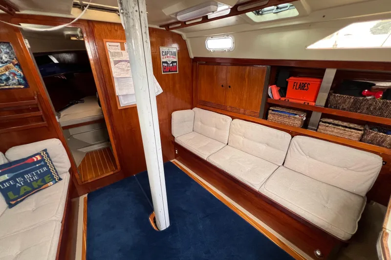 Slide: The Image of Interior of 1985 C&C Landfall 39 sailboat with cozy seating and nautical decor. - 30