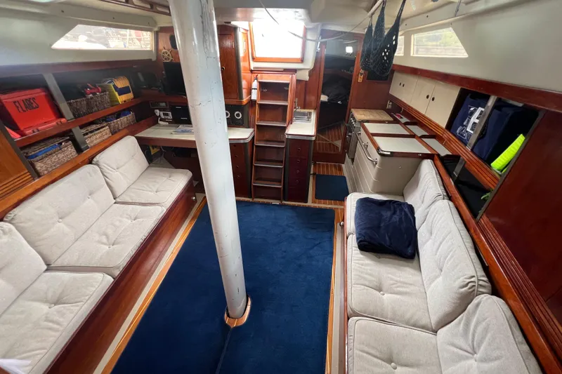 Slide: The Image of Interior of 1985 C&C Landfall 39 sailboat with cozy seating and wooden cabinetry. - 34
