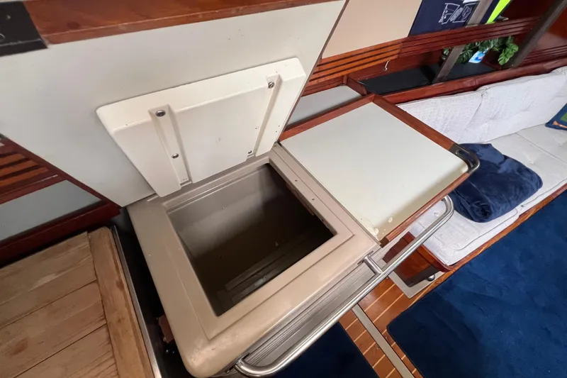 Slide: The Image of Interior of 1985 C&C Landfall 39 sailboat showing open storage compartment. - 35