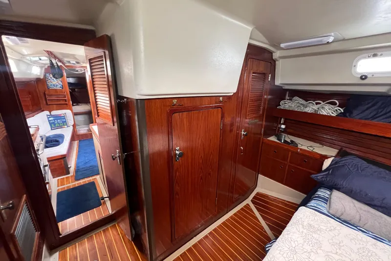 Slide: The Image of Interior of 1985 C&C Landfall 39 sailboat with wood paneling and cozy cabin. - 41