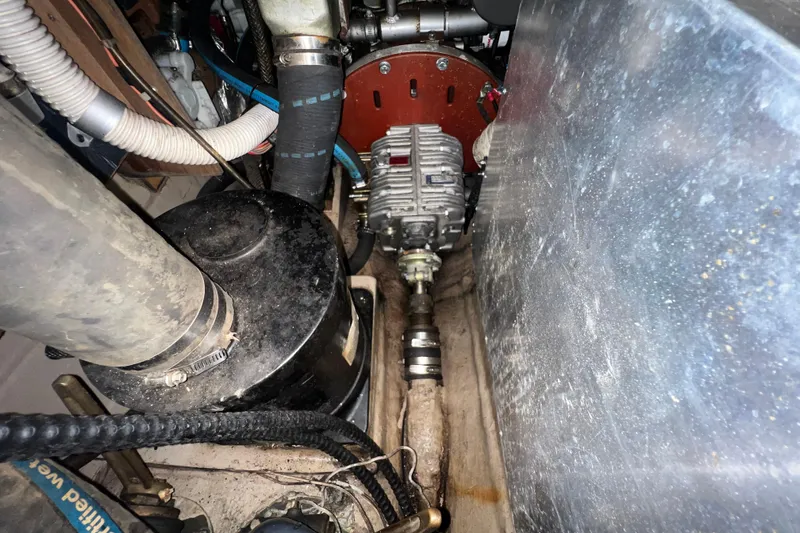 Slide: The Image of Engine compartment of a 1985 C&C Landfall 39 sailboat, showing mechanical components. - 44