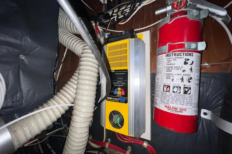 Slide: The Image of Electrical system and fire extinguisher inside 1985 C&C Landfall 39 yacht. - 46