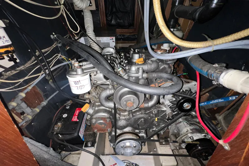 Slide: The Image of Engine compartment of a 1985 C&C Landfall 39 sailboat, showing detailed wiring and components. - 52