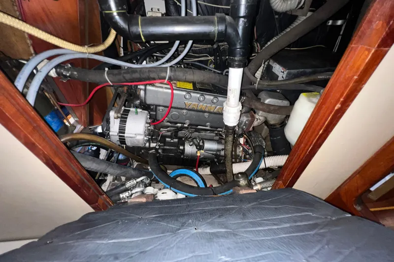 Slide: The Image of Engine compartment of a 1985 C&C Landfall 39 sailboat, featuring a Yanmar engine. - 55