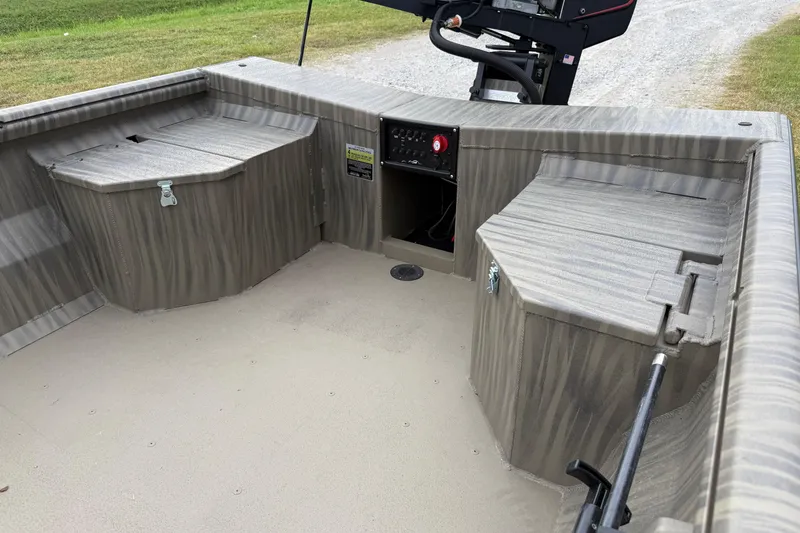 Slide: The Image of 2026 Gator Tail 1754 Extreme boat interior with storage compartments and control panel. - 4