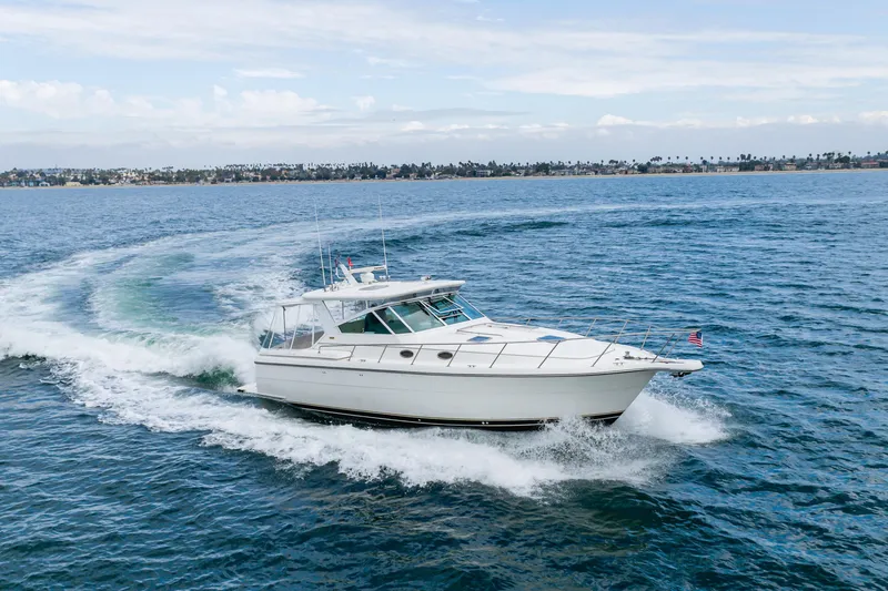 Slide: The Image of 2004 Tiara Yachts 4000 Express cruising on open water. - 14