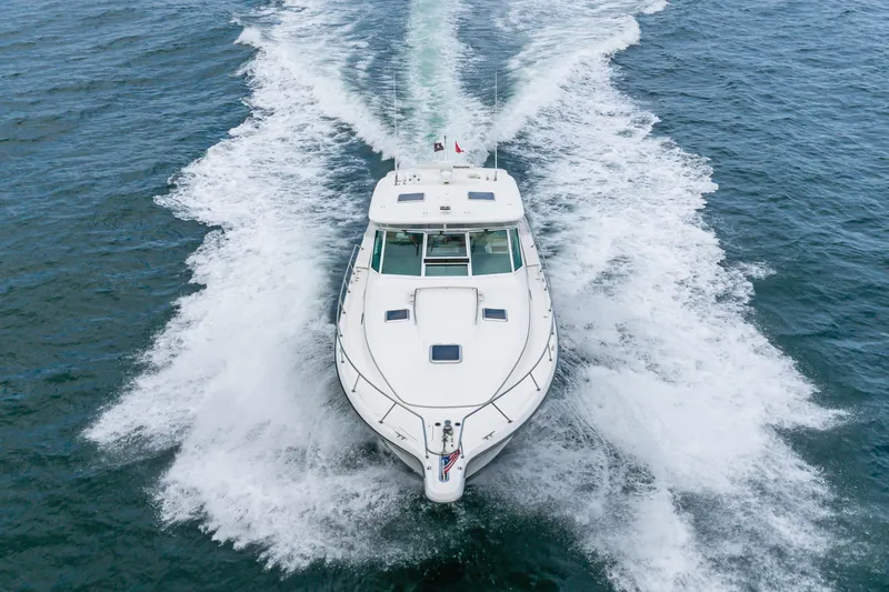 Slide: The Image of 2004 Tiara Yachts 4000 Express cruising on open water, aerial view. - 16
