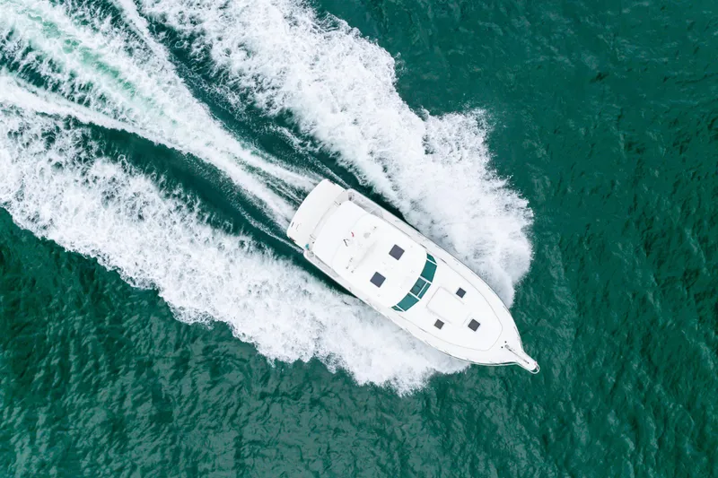 Slide: The Image of Aerial view of 2004 Tiara Yachts 4000 Express cruising on open water. - 20
