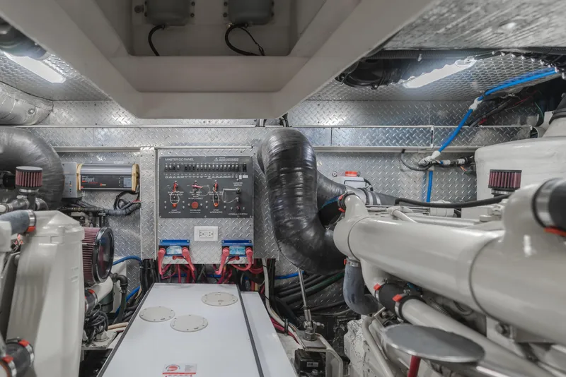 Slide: The Image of Engine room of 2004 Tiara Yachts 4000 Express, featuring control panel and machinery. - 21
