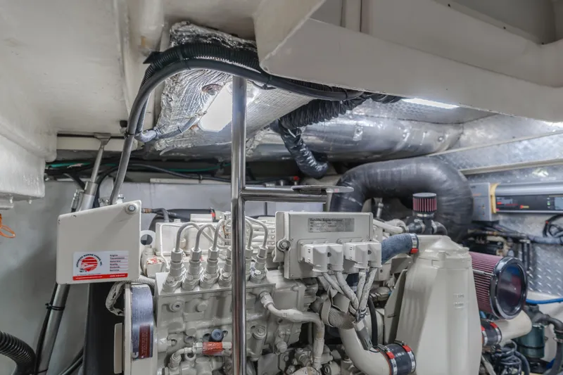 Slide: The Image of Engine room of 2004 Tiara Yachts 4000 Express, showcasing mechanical components and wiring. - 22