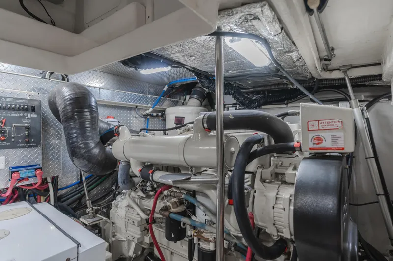 Slide: The Image of Engine room of 2004 Tiara Yachts 4000 Express, showcasing mechanical components and wiring. - 23
