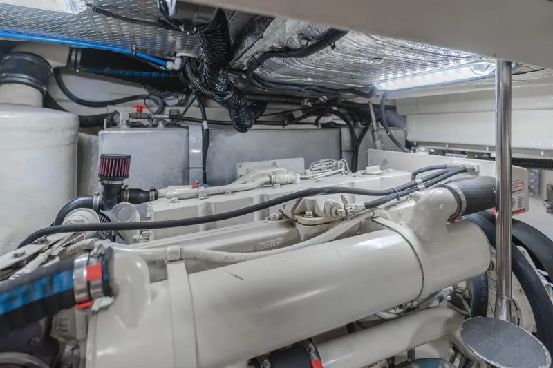 Slide: The Image of Engine room of 2004 Tiara Yachts 4000 Express, showcasing detailed mechanical components. - 26