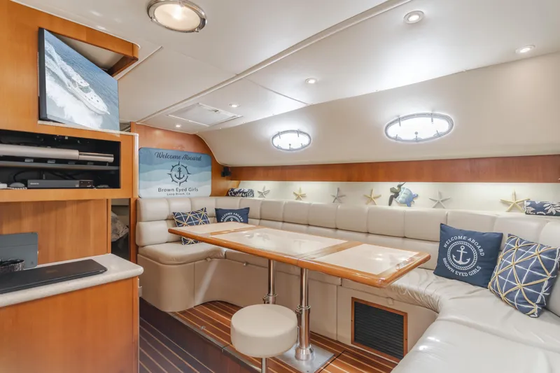 Slide: The Image of Luxurious interior of 2004 Tiara Yachts 4000 Express with elegant seating and nautical decor. - 38