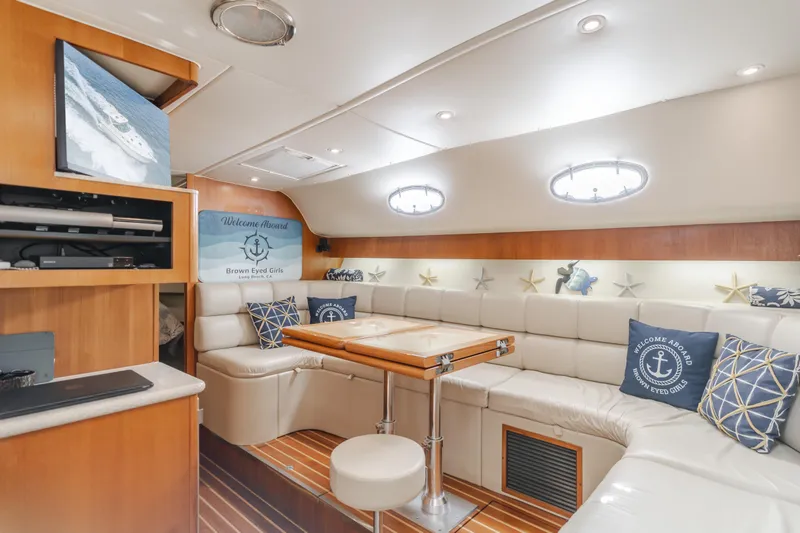 Slide: The Image of Luxurious interior of 2004 Tiara Yachts 4000 Express with plush seating and nautical decor. - 39