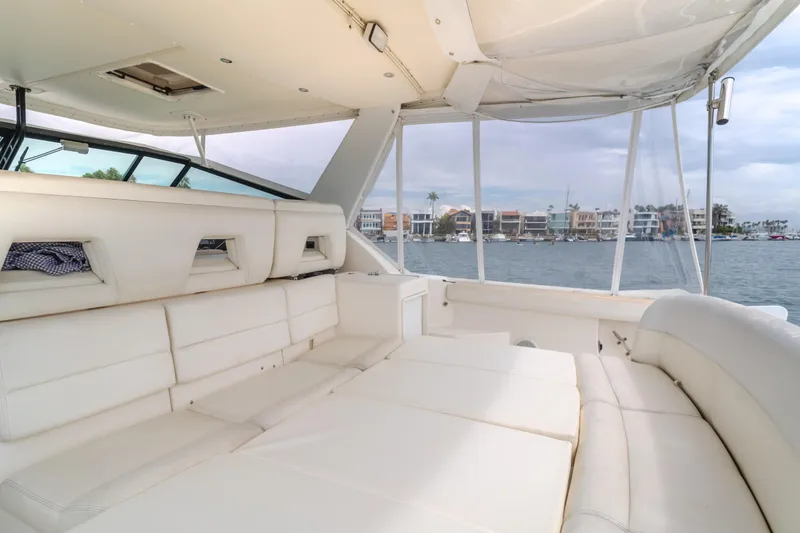 Slide: The Image of Luxurious 2004 Tiara Yachts 4000 Express interior with white seating and waterfront view. - 46