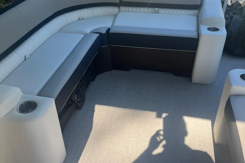 Slide: The Image of 2026 Avalon 23 LSZ Elite boat interior with plush seating and cup holders. - 3
