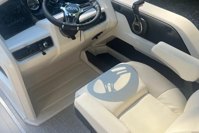 Slide: The Image of 2026 Avalon 23 LSZ Elite boat interior with steering wheel and comfortable seating. - 4