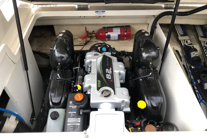 Slide: The Image of Engine compartment of a 2020 Sea Ray SDX 290 boat with visible fire extinguisher. - 14