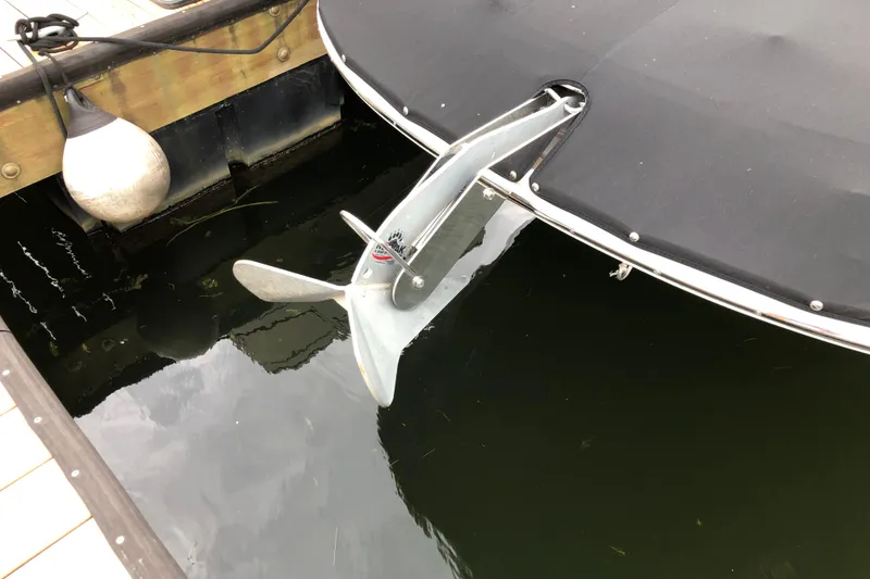 Slide: The Image of 2020 Sea Ray SDX 290 boat with anchor, docked at marina. - 2