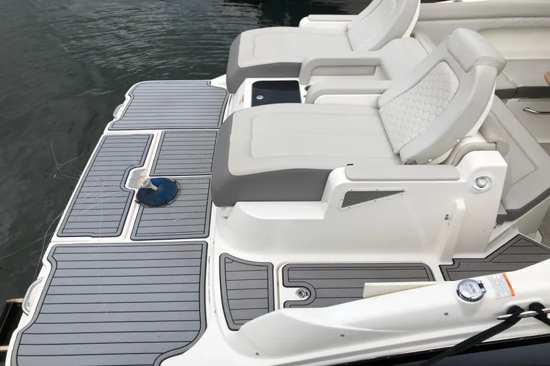 Slide: The Image of 2020 Sea Ray SDX 290 boat with cushioned seating and sleek deck design. - 5