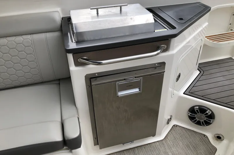 Slide: The Image of Interior of 2020 Sea Ray SDX 290 boat with seating and built-in amenities. - 6