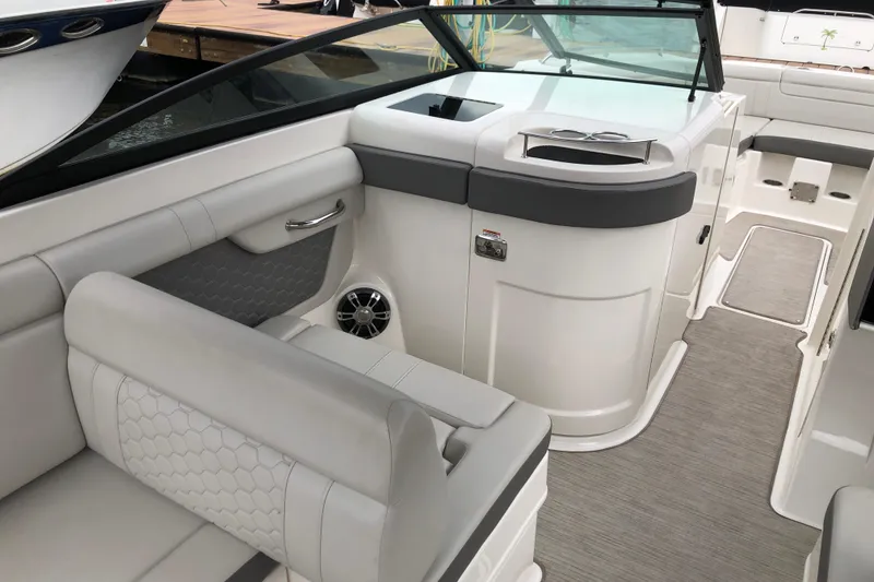 Slide: The Image of 2020 Sea Ray SDX 290 interior with luxurious seating and modern design. - 9