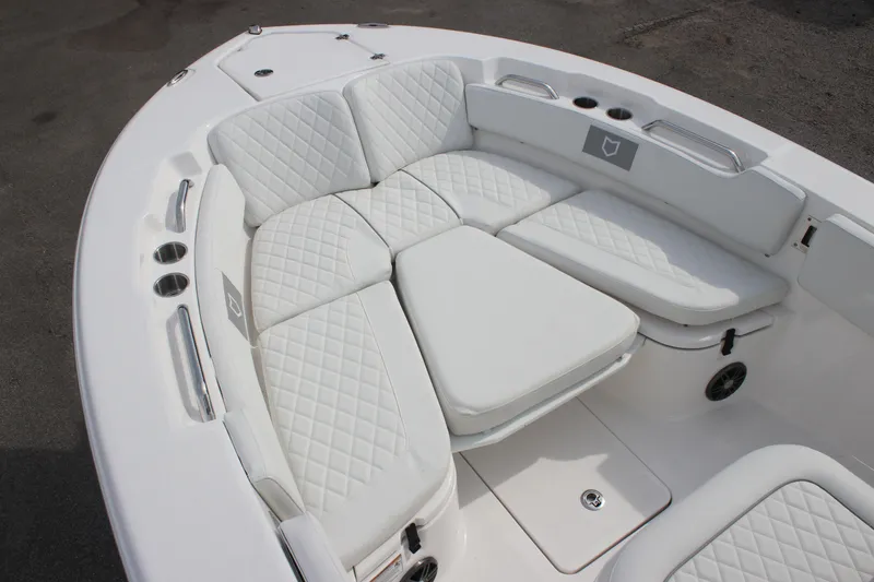 Slide: The Image of 2026 Sea Fox 248 Commander boat with luxurious white seating and cup holders. - 10