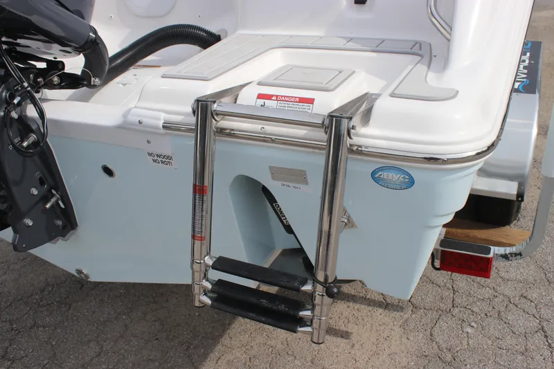 Slide: The Image of Rear view of 2026 Sea Fox 248 Commander boat with ladder and motor details. - 15