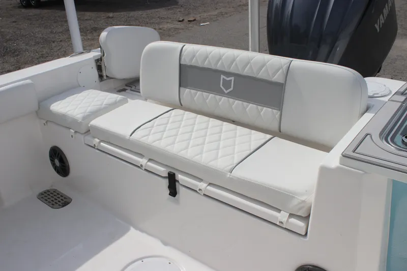 Slide: The Image of 2026 Sea Fox 248 Commander boat with white cushioned seating and Yamaha engine. - 4